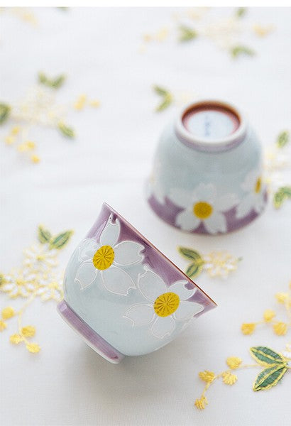 Japanese sencha cups with rounded shape and hand-painted white floral design in soft pastel tones