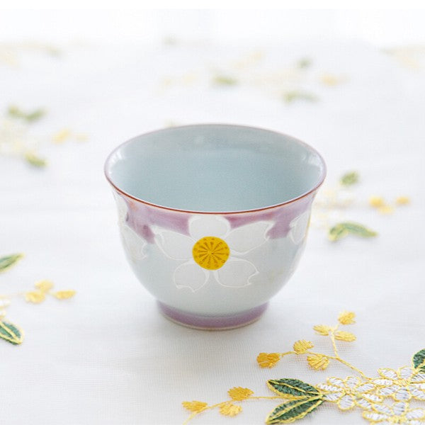Japanese sencha cups with rounded shape and hand-painted white floral design in soft pastel tones