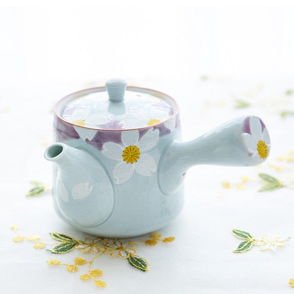 Japanese teapot with side handle and floral design in soft blue and purple with hand-painted white flowers