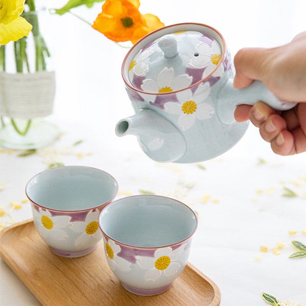 Japanese Hasami ware floral tea set with teapot and two cups in soft blue and purple with hand-painted white flowers