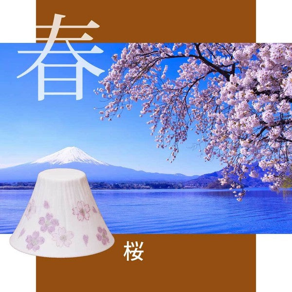 COFIL coffee dripper with cherry blossom design against a scenic backdrop of cherry blossoms and Mount Fuji.