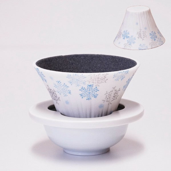 Close-up of winter snow motif on ceramic coffee dripper inspired by Mt. Fuji