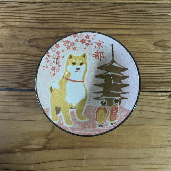 Top view of Shiba Inu x Kyoto ceramic bowl showing cherry blossom and landmark design – made in Japan