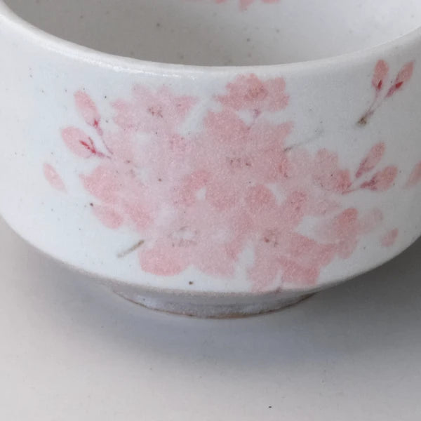 Close-up of pink sakura blossom motif on Japanese Mino ware matcha bowl