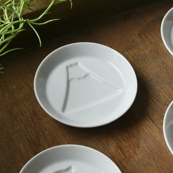 White porcelain dipping plate with sauce revealing a Mount Fuji design, Japanese made mini plate