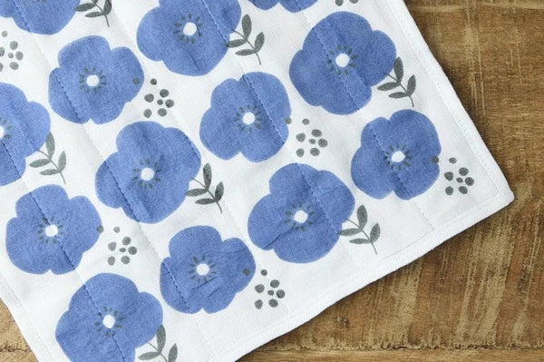 Close-up of blue floral 7-layer kaya fabric cloth showing soft weave texture