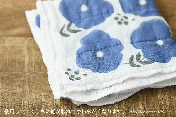 Close-up of blue floral 7-layer kaya fabric cloth showing soft weave texture


