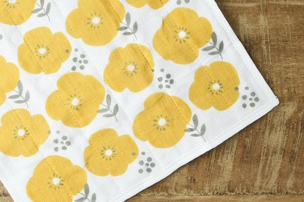Close-up of yellow floral 7-layer kaya fabric cloth showing soft weave texture

