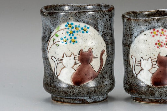 Close-up of Kutani Ware cat tea cup with colorful flowers and traditional Japanese ceramic decoration