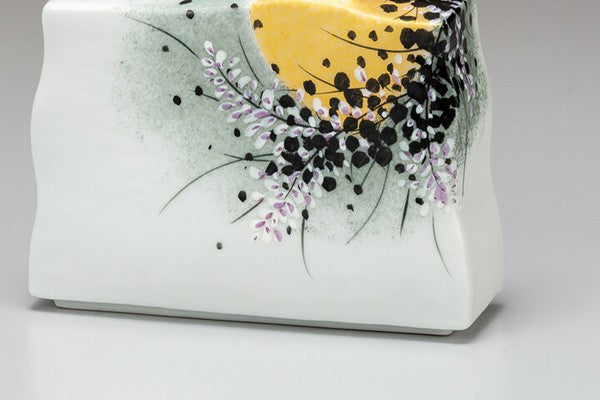 Detail of Kutani ware vase featuring gold accents and delicate floral decoration