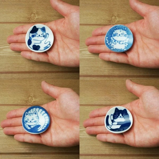 Collage of a person holding four different Nekochigura cat-themed ceramic chopstick rests—Curious Hachi, Sleepy Buchi, Chill Mike, and Striped Tora—each fitting comfortably in the palm, highlighting their small, delicate size and expressive designs.