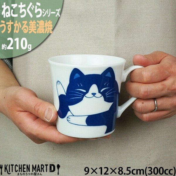 Curious Hachi cat illustration on blue and white Mino ware mug