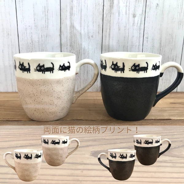 Pair of Mino ware mugs with black cat illustrations in different directions, featuring playful poses and simple ceramic form