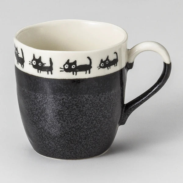 Black Mino ware mugs with black cat illustrations, featuring playful poses and simple ceramic form