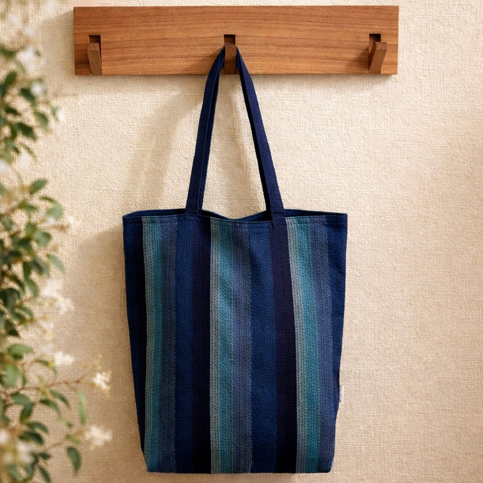 Awa Shijira-ori striped cotton tote bag hanging on wooden hook, lightweight Japanese eco bag made in Tokushima