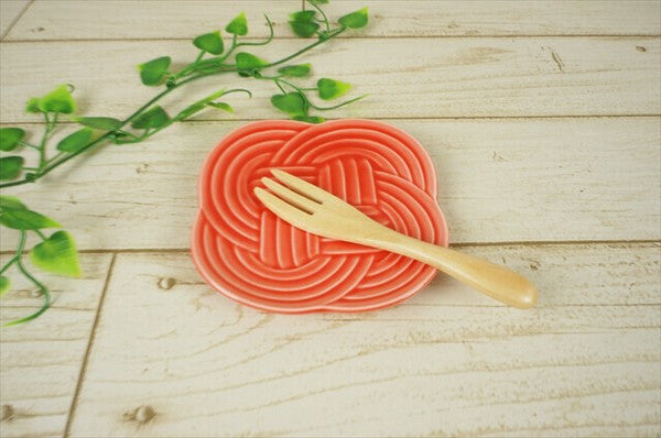 Red Musubi plate showing knot-inspired embossed pattern, Mino ware ceramic