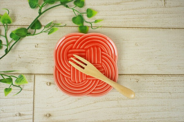 Red Musubi plate showing knot-inspired embossed pattern, Mino ware ceramic