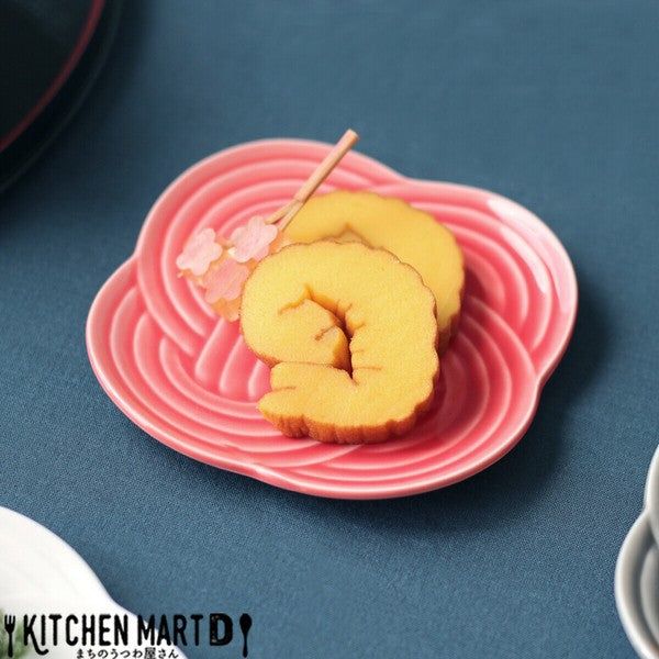 Red Musubi small plate with embossed knot motif, served with deserts.