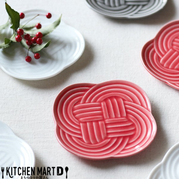 Musubi Mino ware plates in three colors arranged together on table setting