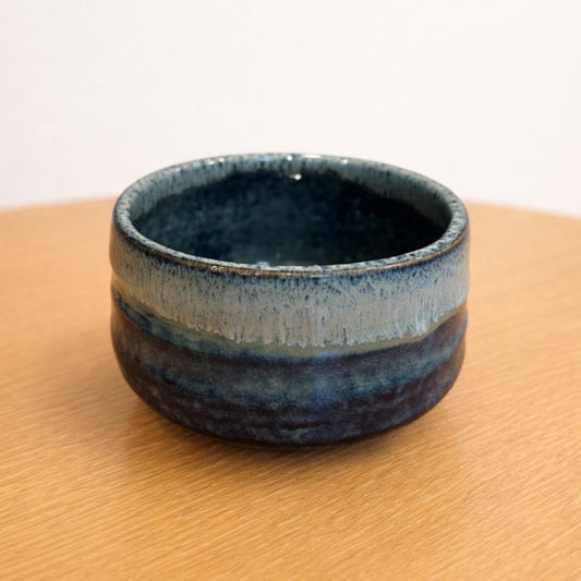 Blue Unofu matcha bowl made in Japan, featuring a soft blue-green glaze and rounded ceramic form.