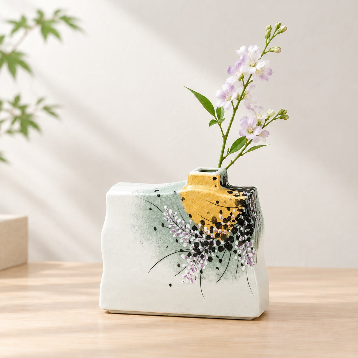 Kutani ware floral vase with delicate flowers, gold and black accents, made in Japan